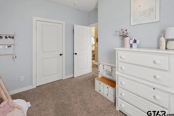 a room with bed and a cabinets