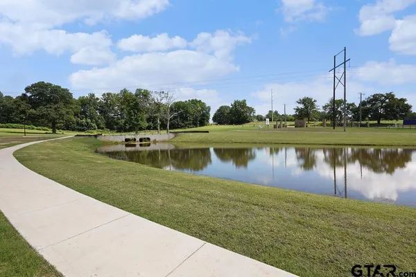 a view of a lake with a big yard