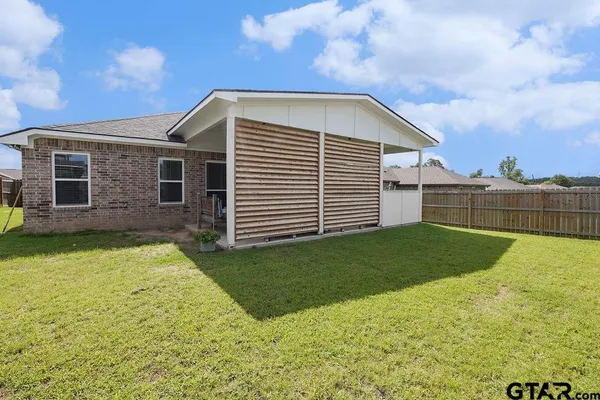 a view of a backyard with a garden