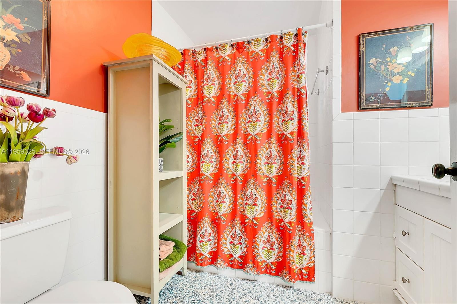 4534 Southwest 147th Court Miami, FL 33185 - Photo 14 of 22 a bathroom with a sink and a shower curtain