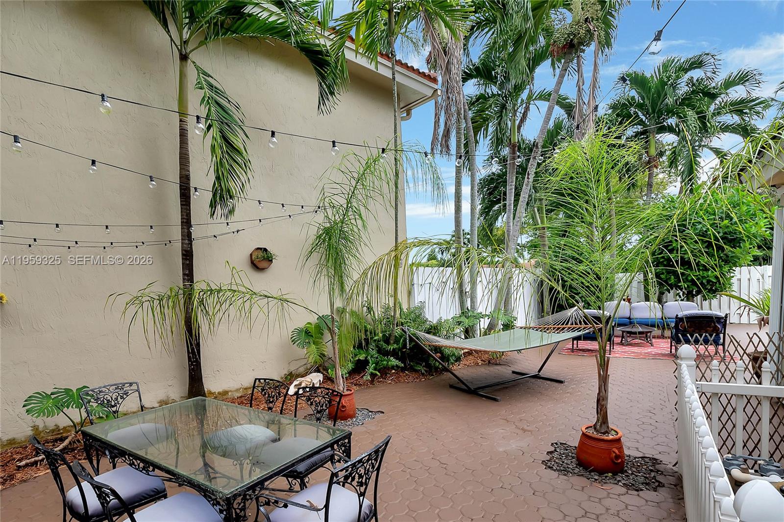4534 Southwest 147th Court Miami, FL 33185 - Photo 20 of 22 a backyard of a house with barbeque oven table and chairs