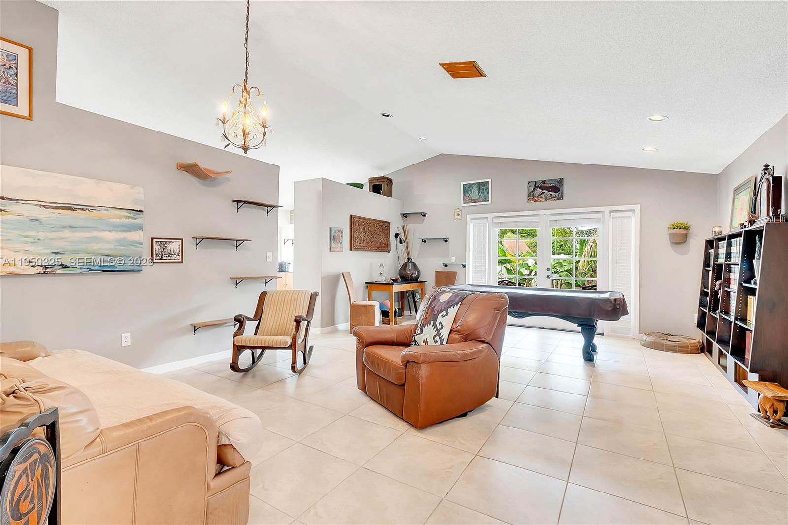4534 Southwest 147th Court Miami, FL 33185 - Photo 2 of 22 a living room with furniture and a flat screen tv
