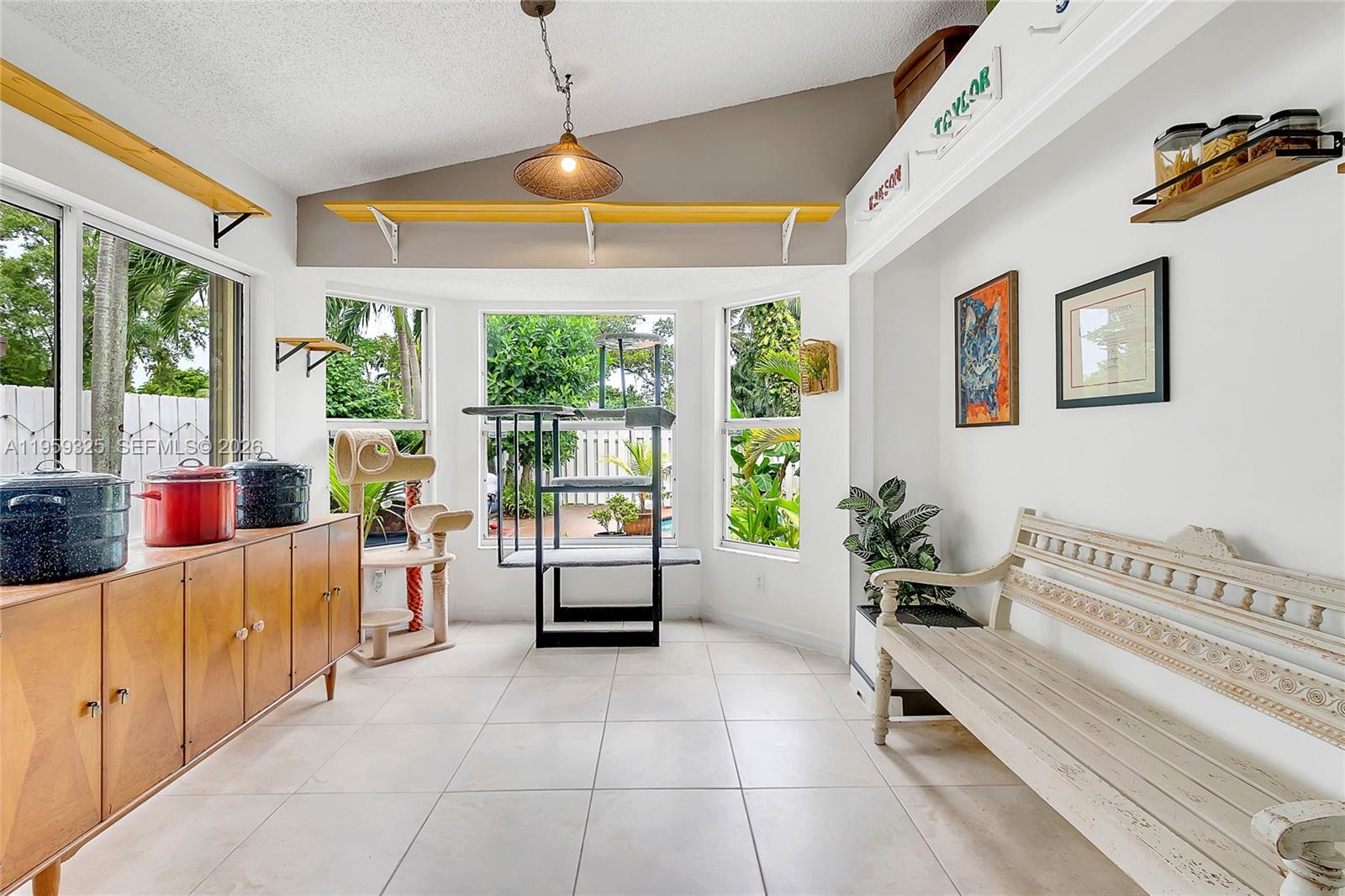 4534 Southwest 147th Court Miami, FL 33185 - Photo 6 of 22 a living room with furniture and a large window