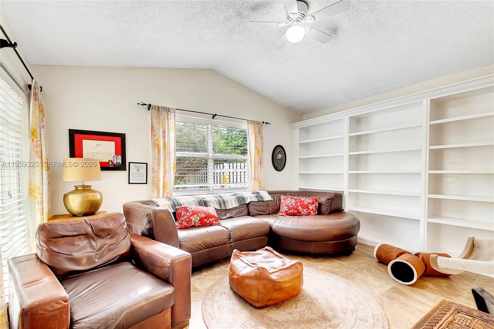 4534 Southwest 147th Court Miami, FL 33185 - Photo 7 of 22 a living room with furniture and a window