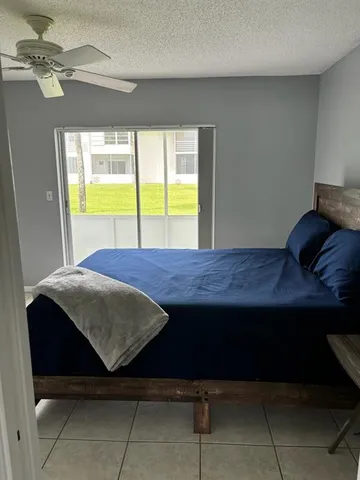 a room with a bed and a window
