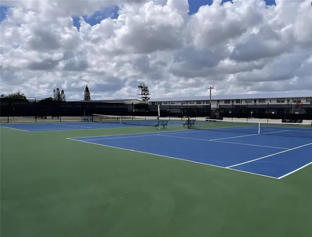 a view of a chairs and table in a patio