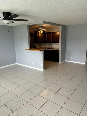 a view of a kitchen counter space with cabinets