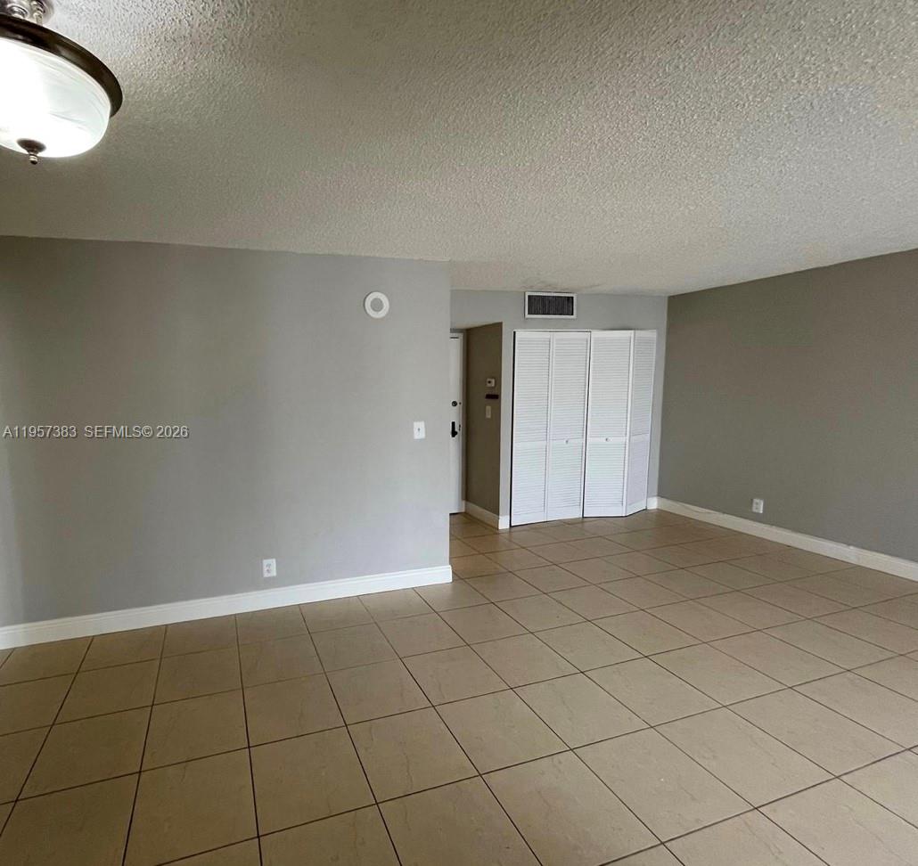 16909 North Bay Road, Unit 807 Sunny Isles Beach, FL 33160 - Photo 11 of 15 a view of an empty room and window