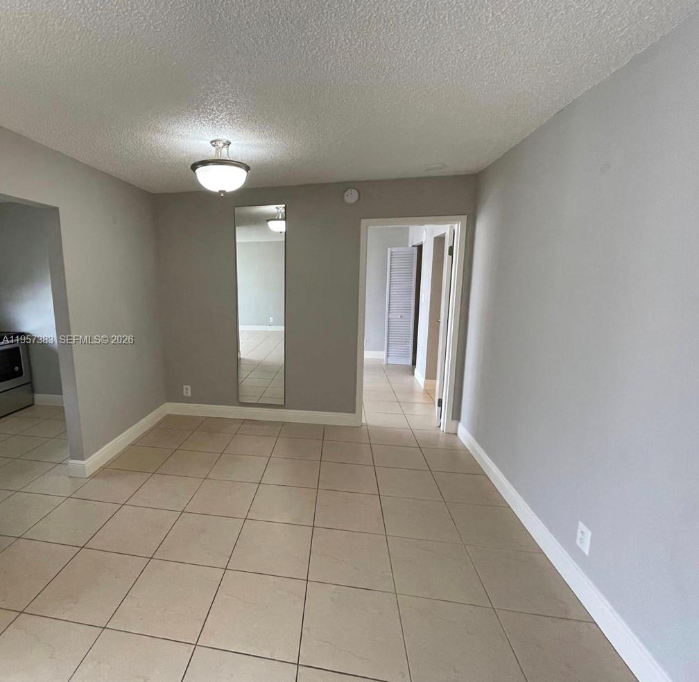 16909 North Bay Road, Unit 807 Sunny Isles Beach, FL 33160 - Photo 5 of 15 a view of an empty room and window