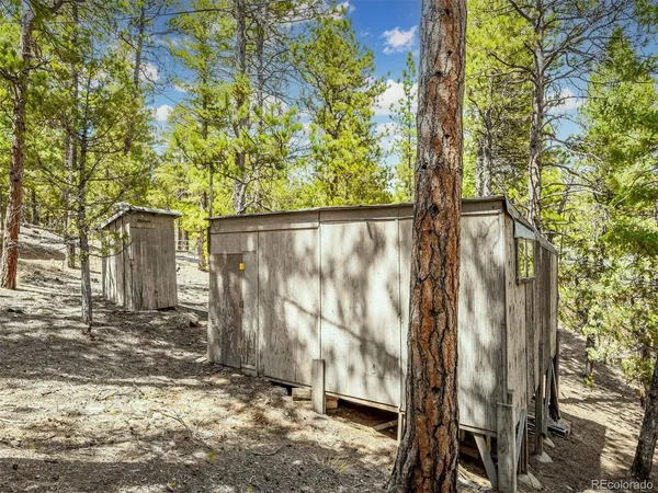 a view of a house with a tree back yard