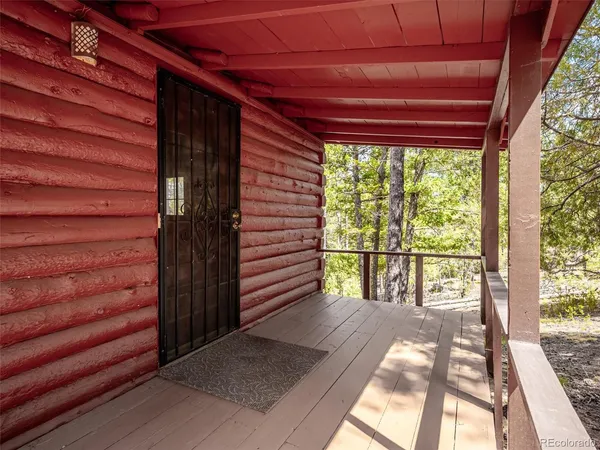 a view of balcony with wooden floor