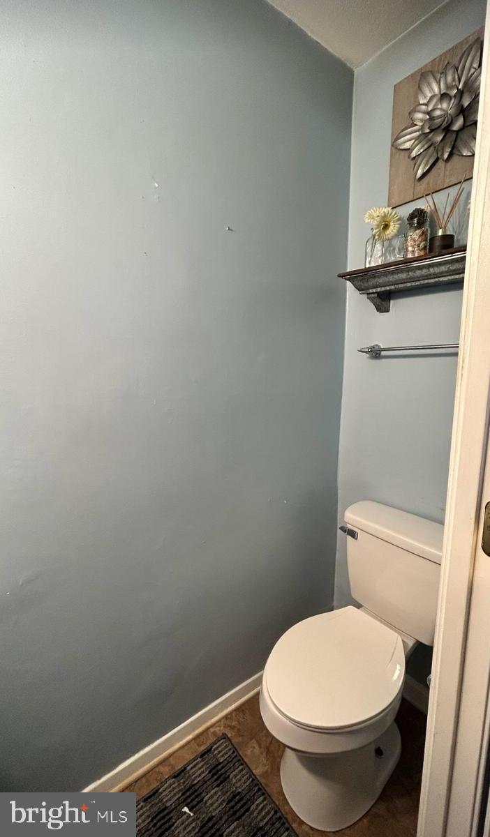 17520 Hoskinson Road Poolesville, MD 20837 - Photo 11 of 13 a bathroom with a toilet and a sink