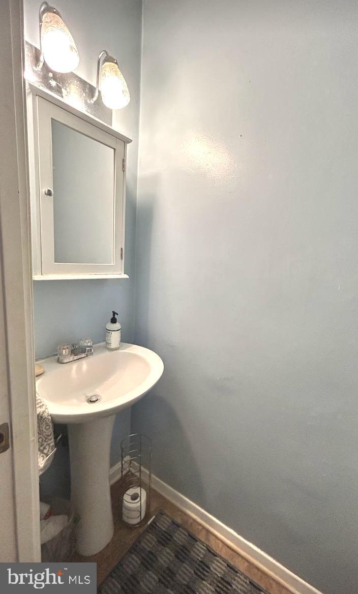 17520 Hoskinson Road Poolesville, MD 20837 - Photo 12 of 13 a bathroom with a sink and a mirror