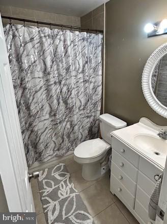 17520 Hoskinson Road Poolesville, MD 20837 - Photo 13 of 13 a bathroom with a toilet and a shower curtain