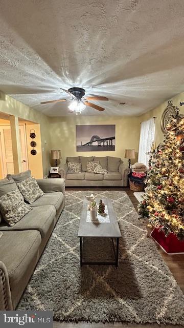 17520 Hoskinson Road Poolesville, MD 20837 - Photo 7 of 13 a living room with furniture and a chandelier