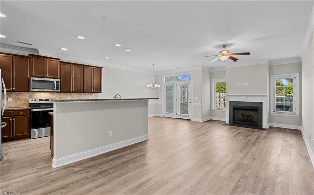 4323 Holstein Drive High Point, NC 27265 - Photo 3 of 24 Living room, dining room, and kitchen area