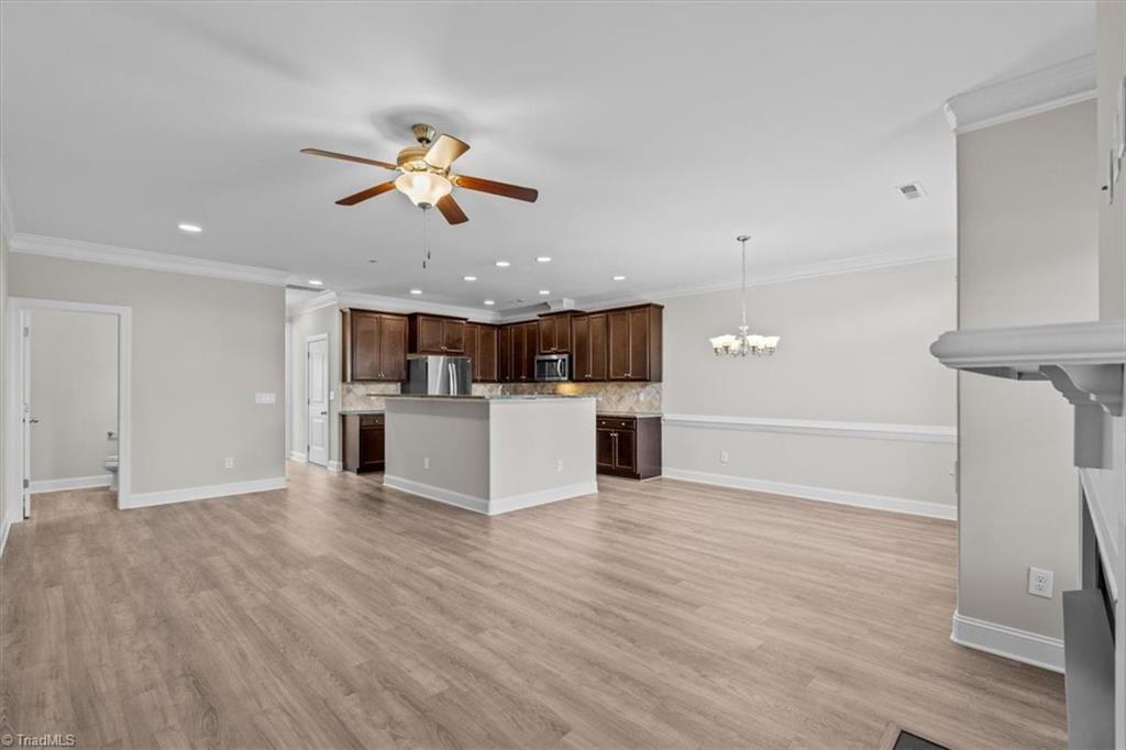 4323 Holstein Drive High Point, NC 27265 - Photo 4 of 24 Living room, dining room, and kitchen area