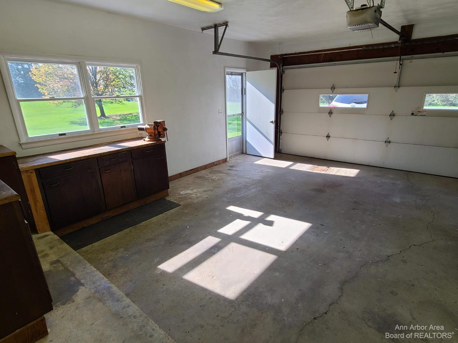 11081 Dexter-Chelsea Road Dexter, MI 48130 - Photo 25 of 36 Lots of natural light in the garage.