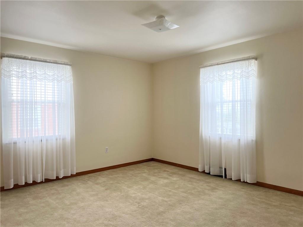 233 Reed Street Lower Burrell, PA 15068 - Photo 28 of 40 Bedroom 3 with wall to wall carpet. Hardwood under carpet.