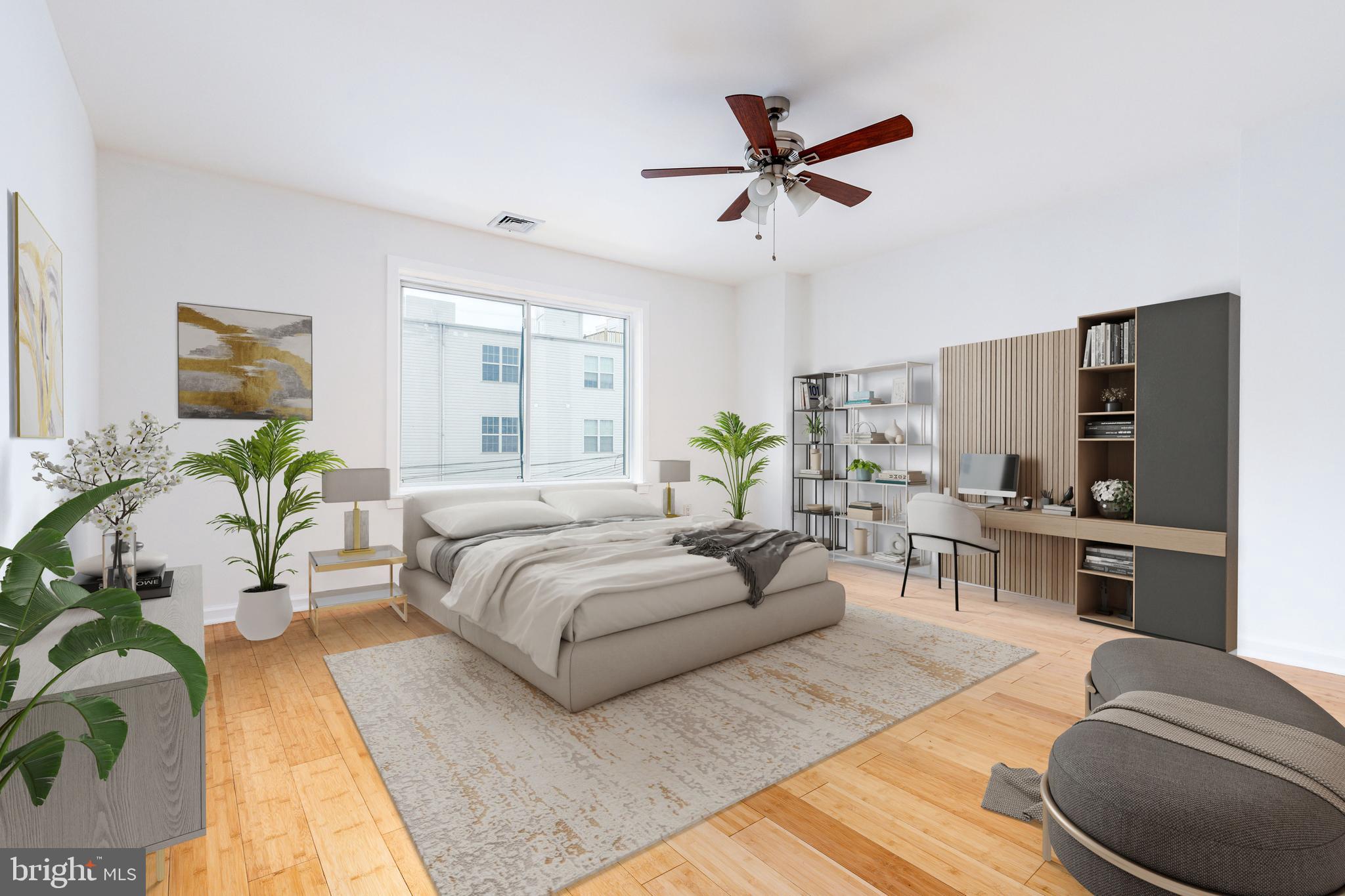 2726 Edgemont Street Philadelphia, PA 19134 - Photo 14 of 32 a living room with furniture ceiling fan and a window