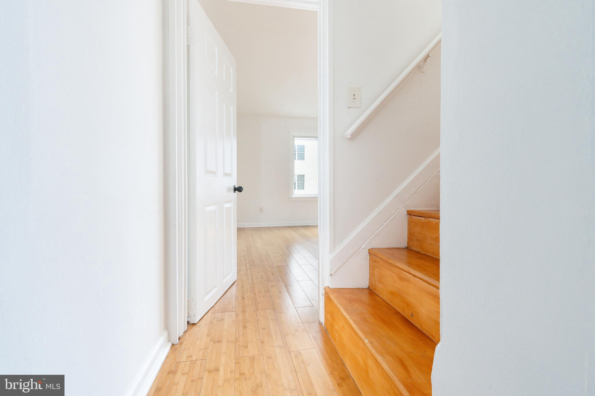 2726 Edgemont Street Philadelphia, PA 19134 - Photo 19 of 32 a view of a hallway with wooden floor and staircase