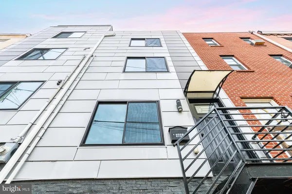 a picture of a building with a bench