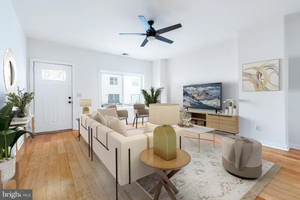 a living room with furniture and a table