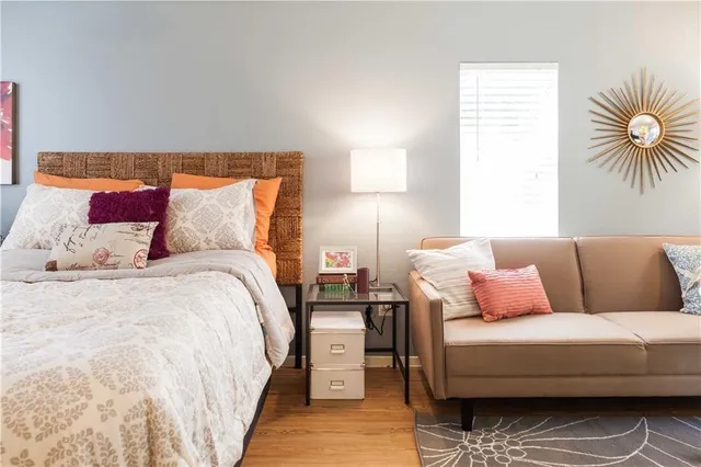 a bedroom with a bed and a couch