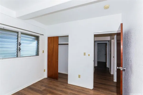 a view of an entryway with wooden floor