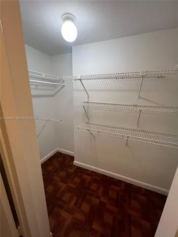 a view of a room with racks on the wall