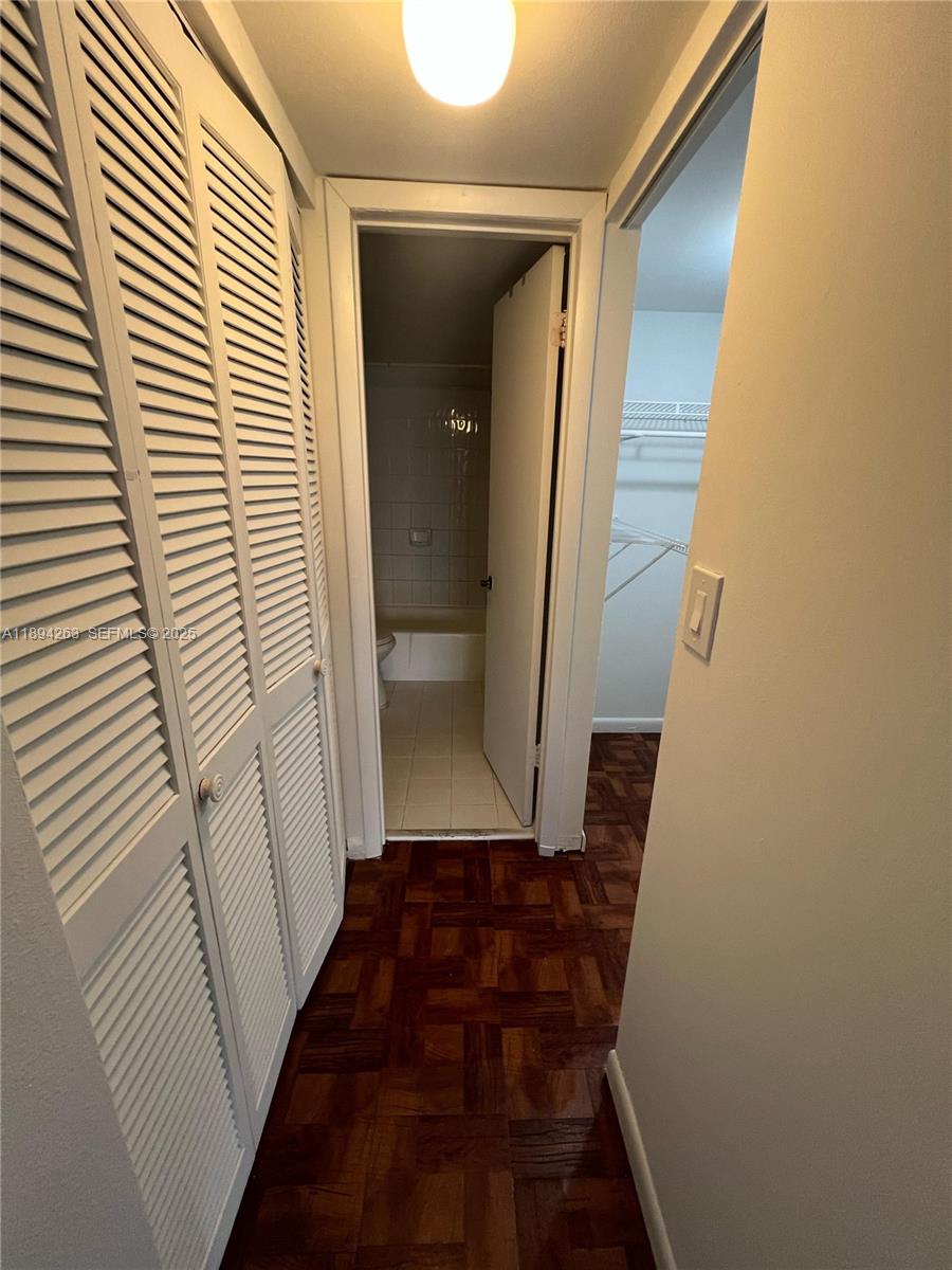 17901 Northwest 68th Avenue, Unit Q103 Hialeah, FL 33015 - Photo 6 of 33 a view of a hallway