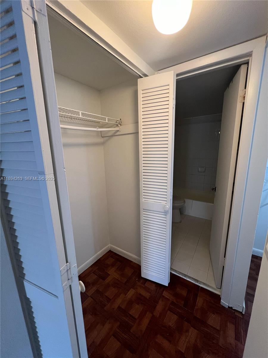 17901 Northwest 68th Avenue, Unit Q103 Hialeah, FL 33015 - Photo 7 of 33 a view of walk in closet