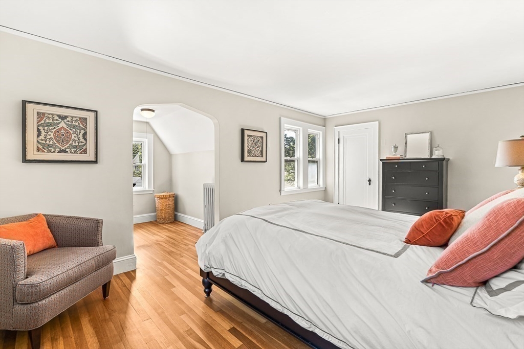 15 White Oak Road Boston, MA 02132 - Photo 15 of 24 a bedroom with a bed and wooden floor
