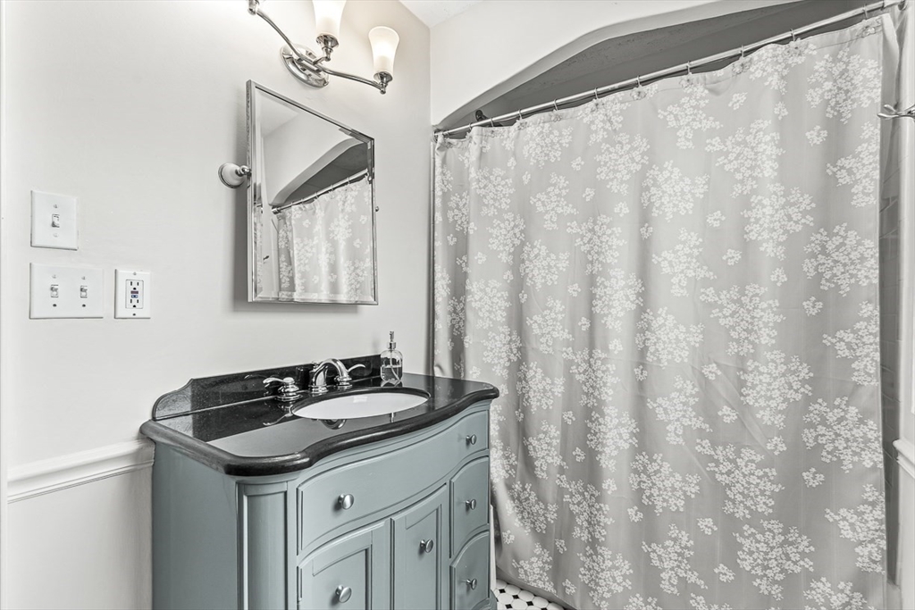 15 White Oak Road Boston, MA 02132 - Photo 16 of 24 a sink and dishwasher with a kitchen view