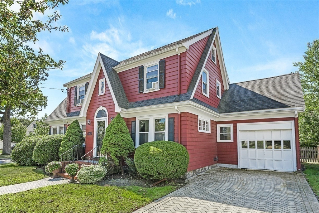 15 White Oak Road Boston, MA 02132 - Photo 22 of 24 a front view of a house with garden