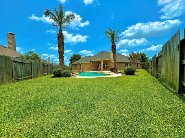 a view of a house with a big yard