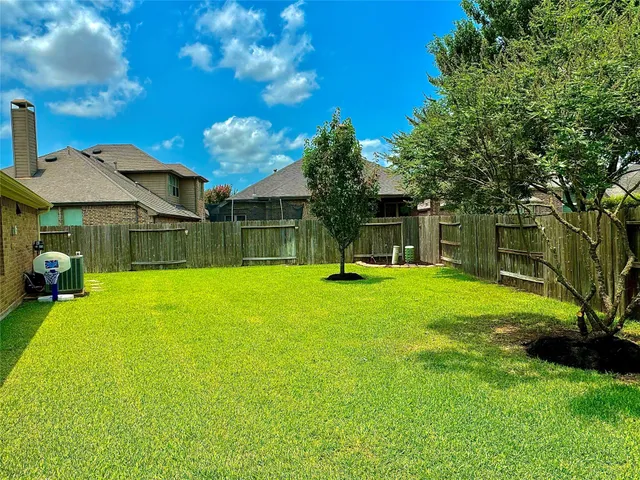 a view of a house with a yard porch and sitting area