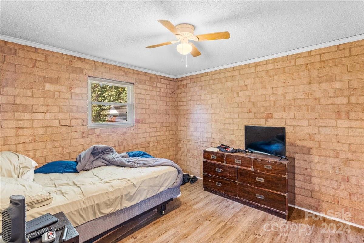 4251 Kiser Island Road Terrell, NC 28682 - Photo 15 of 30 a bedroom with a bed and a flat screen tv