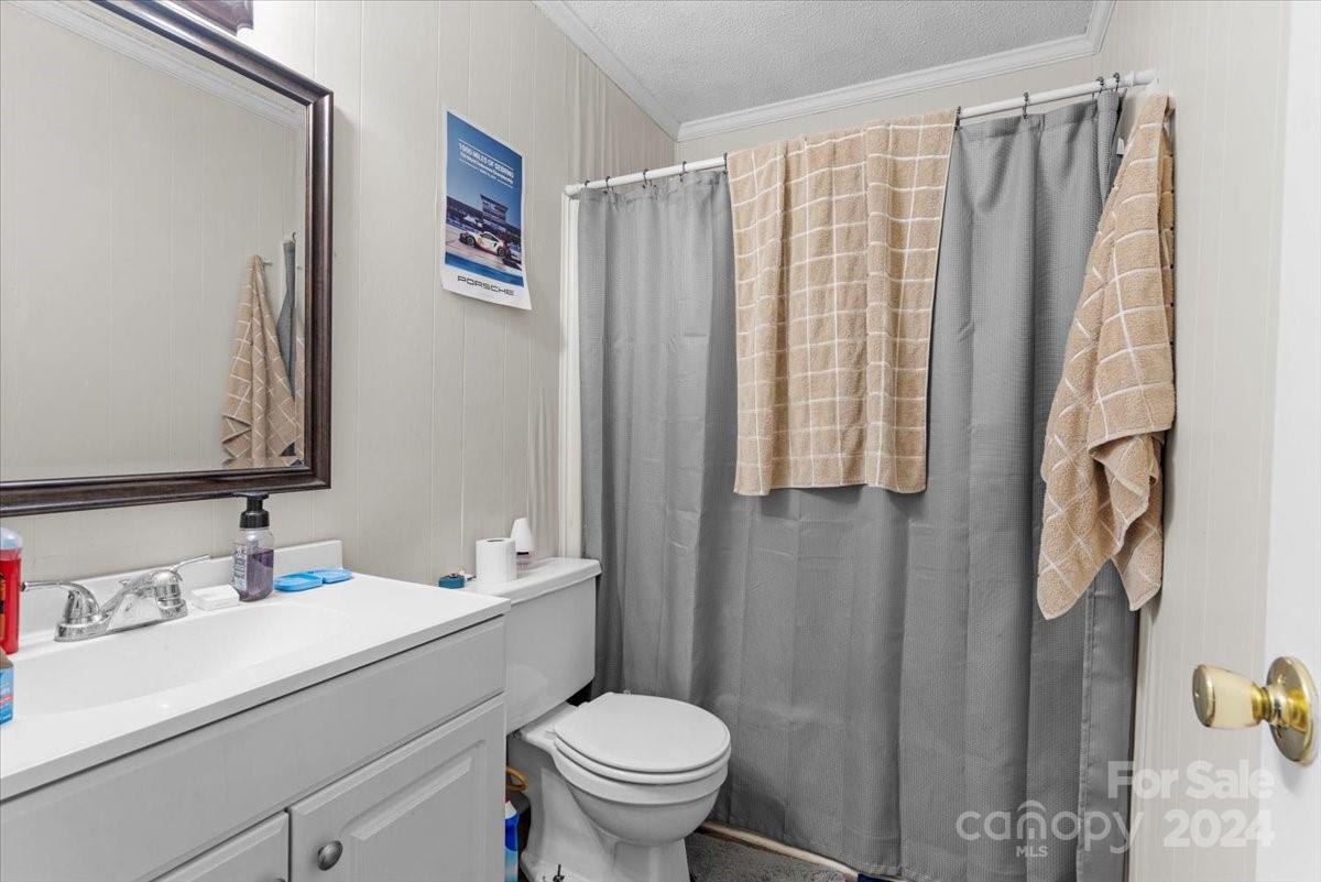 4251 Kiser Island Road Terrell, NC 28682 - Photo 19 of 30 a bathroom with a sink toilet and shower