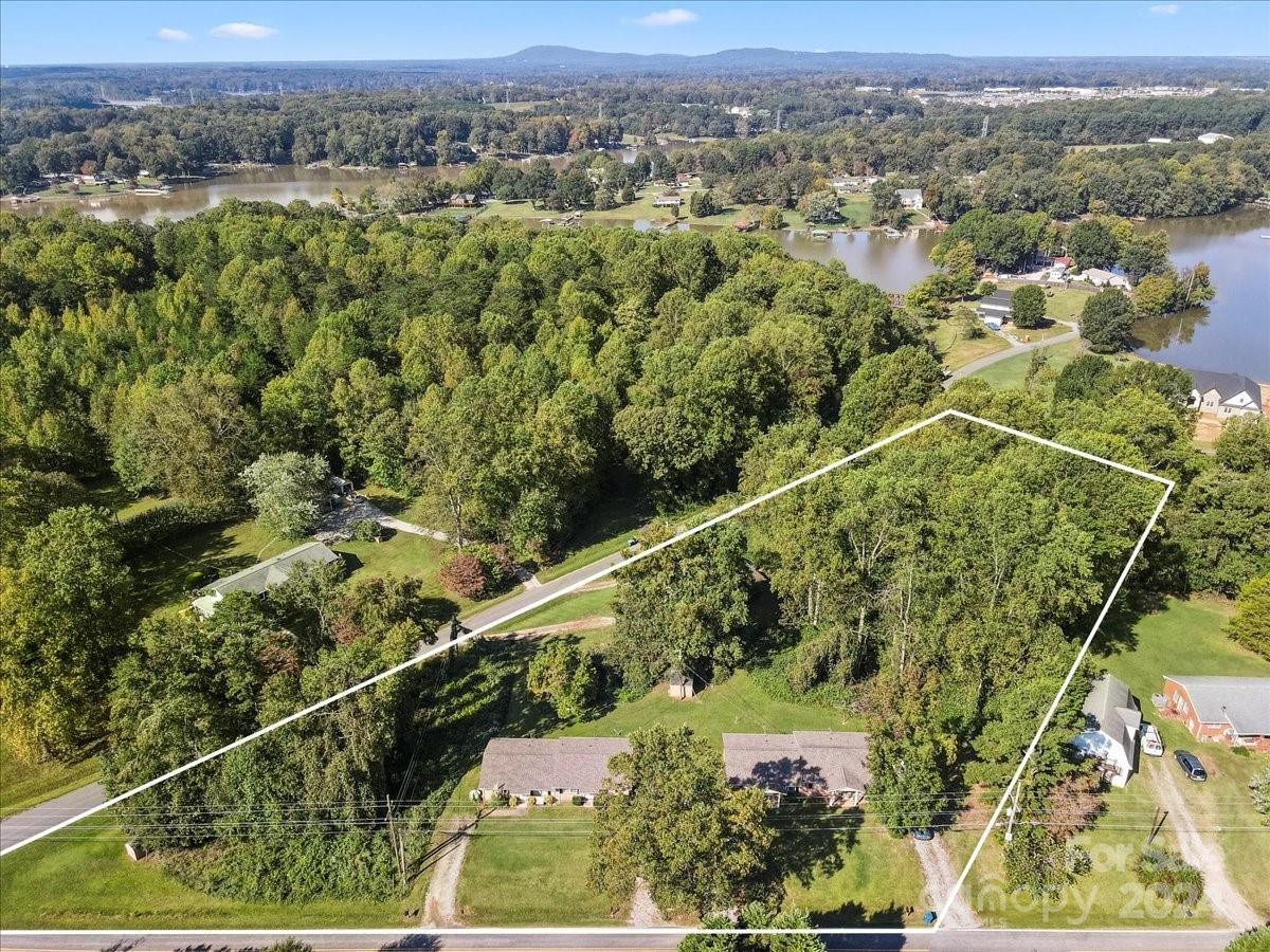 4251 Kiser Island Road Terrell, NC 28682 - Photo 23 of 30 an aerial view of a residential houses covered with trees