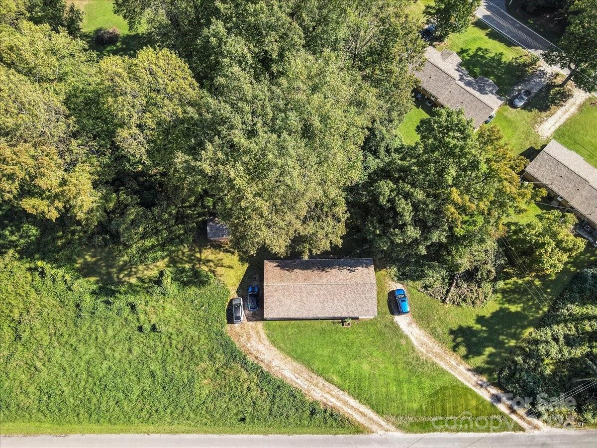 4251 Kiser Island Road Terrell, NC 28682 - Photo 25 of 30 an aerial view of a house with a yard and trees all around
