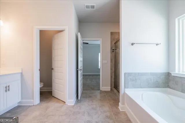 a bathroom with a bathtub and a sink
