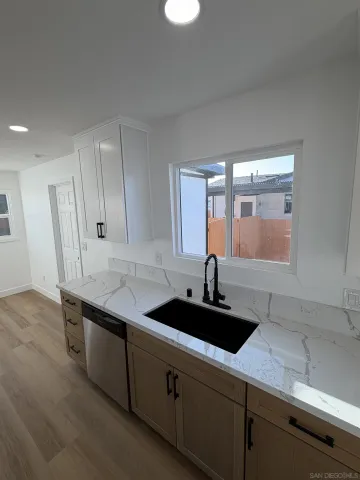 a kitchen with a sink and cabinets