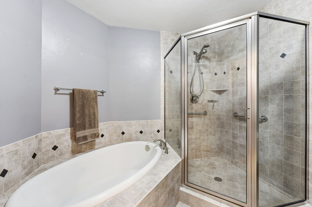 7235 Viansa Court Midvale, UT 84047 - Photo 15 of 43 Full bathroom with a bath and a stall shower