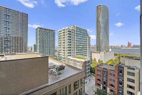 a view of a tall building from a balcony