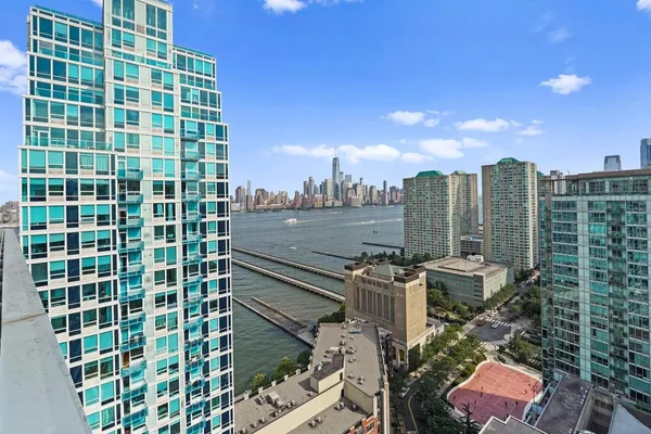 a bedroom with a large bed and a large window