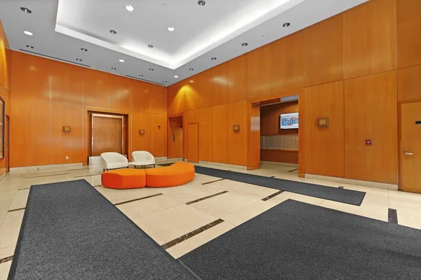 a living room with patio furniture and a large window