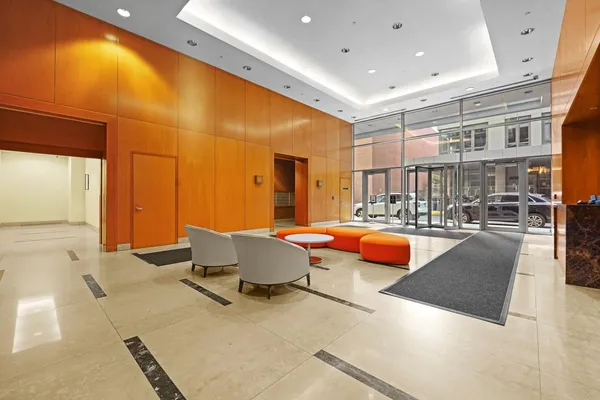 a living room with a large window and a table