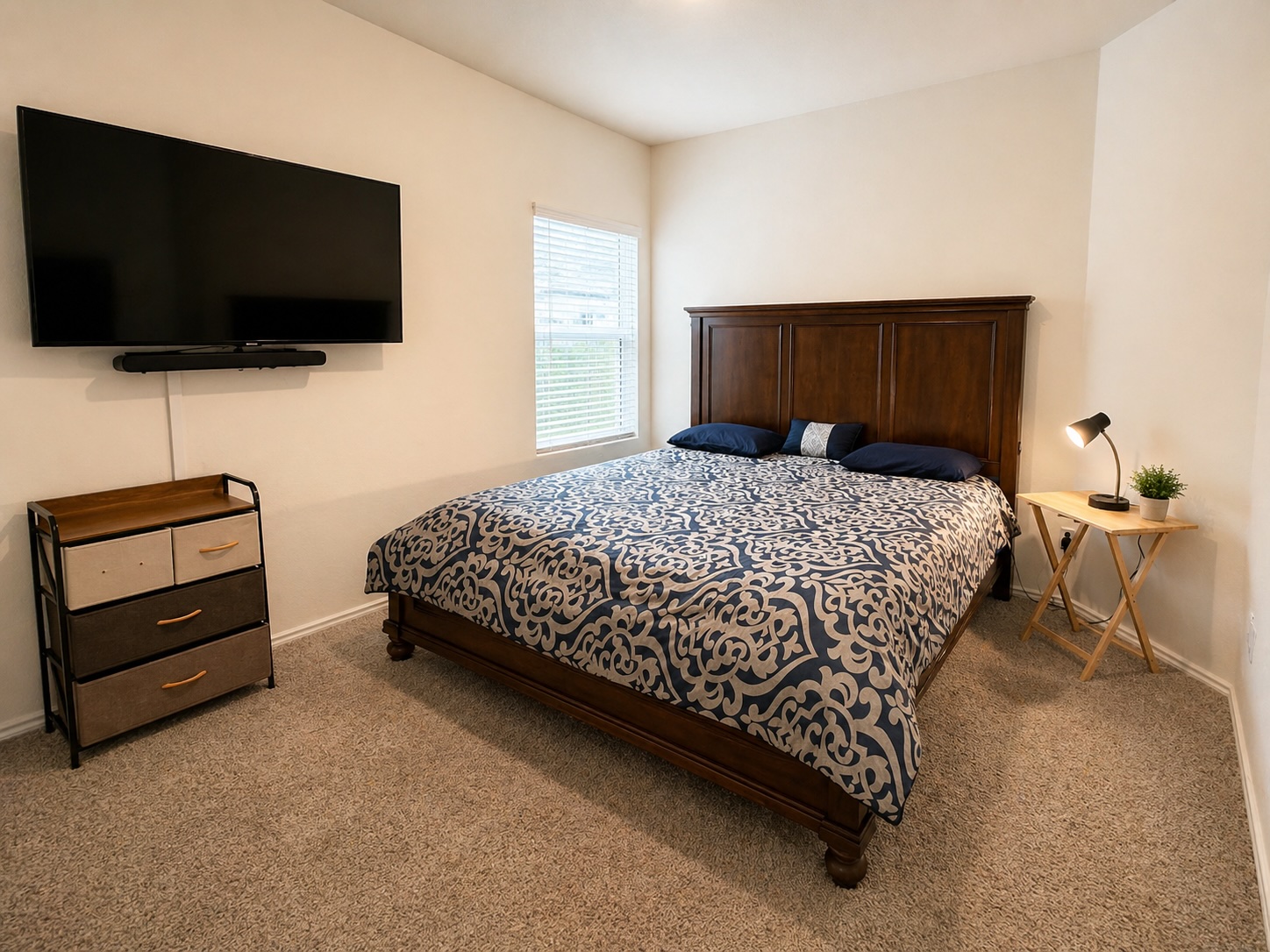 108 Blue Blaze Trail Georgetown, TX 78628 - Photo 16 of 26 a bedroom with a bed and a flat screen tv