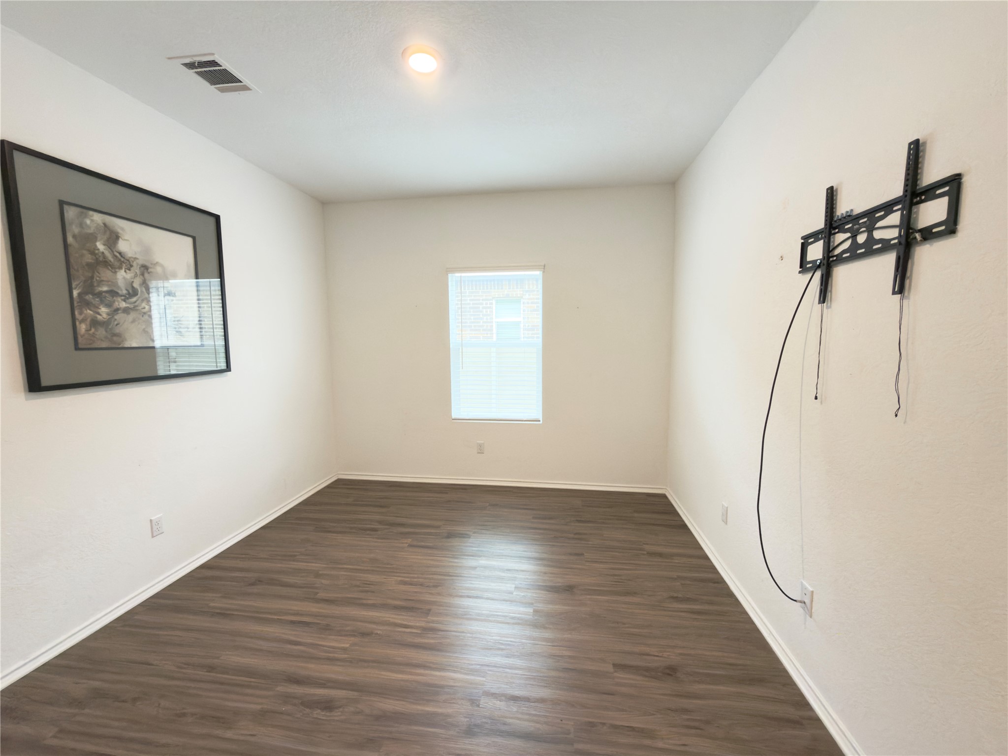 108 Blue Blaze Trail Georgetown, TX 78628 - Photo 20 of 26 an empty room with wooden floor and windows